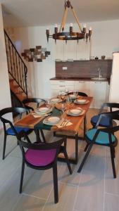 a wooden table with chairs and a dining room at Apartment Tia Vis in Vis