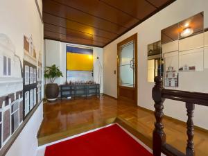 a hallway with a red carpet and a red rug at Ogeri76 in Mokpo