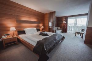 Posteľ alebo postele v izbe v ubytovaní Hotel Continental Dolomites