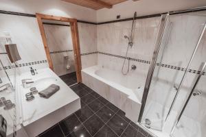 Kúpeľňa v ubytovaní Hotel Continental Dolomites
