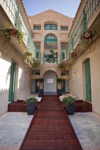 a large building with a walkway leading to it at Boutique Isla Tabarca in Tabarca
