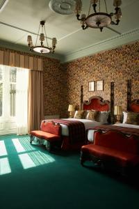 a bedroom with two beds and two chairs in it at Marine North Berwick in North Berwick +37 photos
