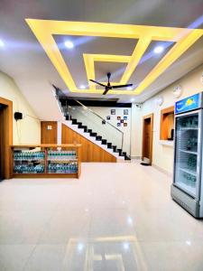 a large room with a staircase in the ceiling at GRACE INN GUEST HOUSE, Near Airport and Ion Digital in Guwahati