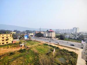 a view of a city with a highway and buildings at GRACE INN GUEST HOUSE, Near Airport and Ion Digital in Guwahati