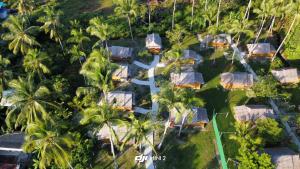 an aerial view of a resort with palm trees at Koh Mook Bungalows in Koh Mook