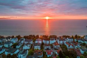 an aerial view of a residential neighborhood at sunset at Ferienwohnung 9 Villa Eden in Binz