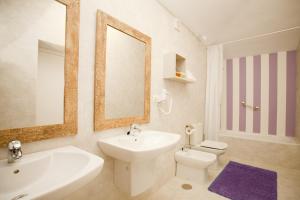 a bathroom with a sink toilet and a mirror at Boutique Isla Tabarca in Tabarca +20 photos