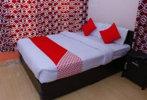 Säng eller sängar i ett rum på Murugan Residency