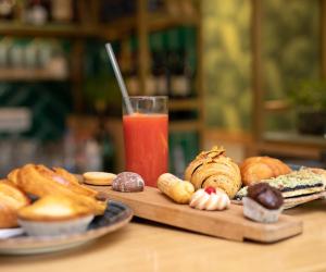 a table with a tray of pastries and a drink at Il Veliero in Castellammare di Stabia