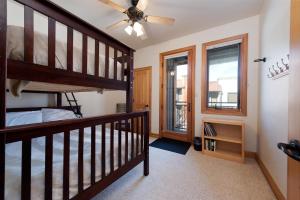 a bedroom with a loft bed and a window at Crimson Cliffs Unit 55 in Durango