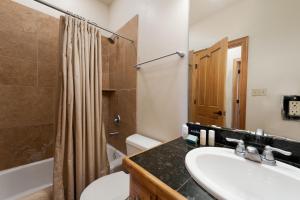 a bathroom with a sink and a toilet and a shower at Crimson Cliffs Unit 55 in Durango +23 photos