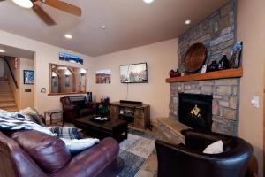 a living room with a couch and a fireplace at Black Bear 110 in Durango Mountain Resort