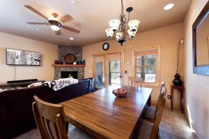 a dining room with a table and a couch at Black Bear 110 in Durango Mountain Resort