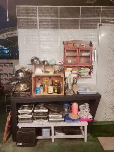 a toy kitchen with a shelf with food and utensils at Bong Gu House in Daegu