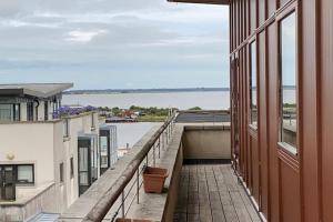 a balcony of a building with a view of the water at Vera’s Penthouse in Wexford