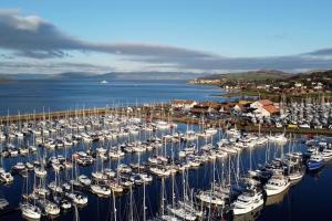 a bunch of boats are docked in a harbor at Stunning Coach House in Largs
