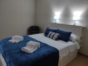 En eller flere senge i et værelse på Malecón Guardes