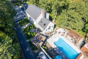 an overhead view of a house with a swimming pool at Barnstable Luxury Family Retreat with pool, fire pit and beach nearby in Barnstable
