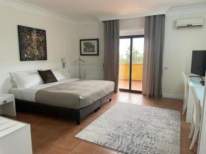 Voodi või voodid majutusasutuse Baia Di Ulisse Wellness & Spa toas