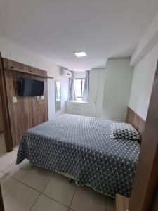 A bed or beds in a room at Ap. Novo Maceió - praia de Ponta verde