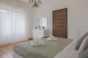 Postel nebo postele na pokoji v ubytování MaisonTuscany - Jacuzzi