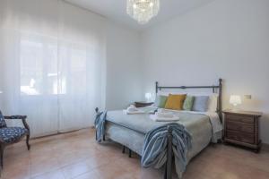 Postel nebo postele na pokoji v ubytování MaisonTuscany - Jacuzzi
