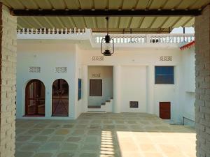 an empty courtyard of a house with a ceiling at Haveli Zorawar in Udaipur