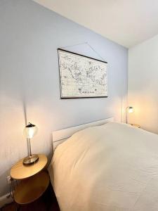 Ένα ή περισσότερα κρεβάτια σε δωμάτιο στο Le Quartz Blanc / Bourg-de-Péage