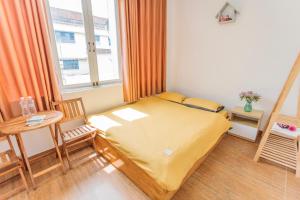 Postel nebo postele na pokoji v ubytování CSLTDL Địa Du