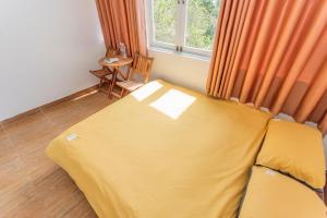 Postel nebo postele na pokoji v ubytování CSLTDL Địa Du