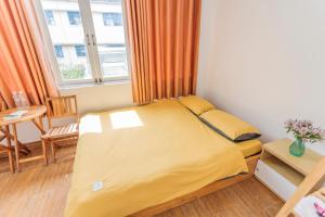 Postel nebo postele na pokoji v ubytování CSLTDL Địa Du