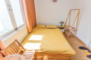 Postel nebo postele na pokoji v ubytování CSLTDL Địa Du