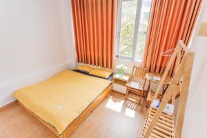 Postel nebo postele na pokoji v ubytování CSLTDL Địa Du