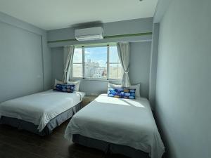 Кровать или кровати в номере Ding Dong Homestay