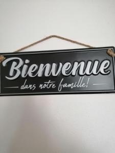a sign that reads berniversary days is hanging on a wall at La Maison des Rosiers in Manhac