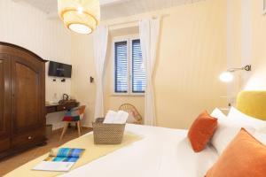 Postel nebo postele na pokoji v ubytování Cagliari Old Town B&B
