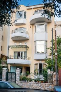 a building with balconies on the side of it at Artistic Villa Luxury in Athens