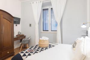 Postel nebo postele na pokoji v ubytování Cagliari Old Town B&B