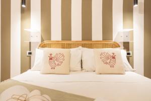 Postel nebo postele na pokoji v ubytování Cagliari Old Town B&B