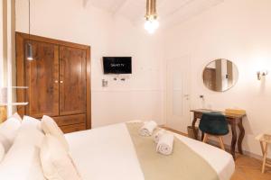 Postel nebo postele na pokoji v ubytování Cagliari Old Town B&B