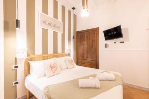Postel nebo postele na pokoji v ubytování Cagliari Old Town B&B