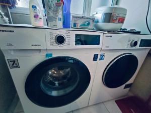 a washing machine sitting in a room with a counter at Melaka Homestay Golden Royal in Melaka