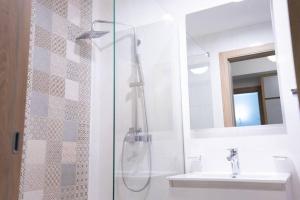 a bathroom with a shower and a sink at Ana Lux Master apartament in Podgorica