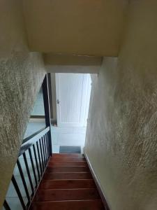 a view of a stairway with a white door at Neatly Furnished Apartment in Mataffin