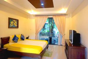 Säng eller sängar i ett rum på Thai Pura Resort