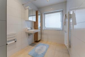 Koupelna v ubytování Apartment Piesendorf + 29 fotografií