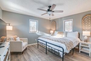 a bedroom with a bed and a ceiling fan at Quiet Tennessee Getaway about 12 Mi to Kentucky Lake! in Paris