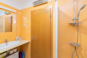 a bathroom with a shower and a sink at Apartment Ruzmarinka with Spacy Terrace in Baška +18 photos