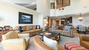 a large living room with couches and a table at Skijor Chalet in Vail