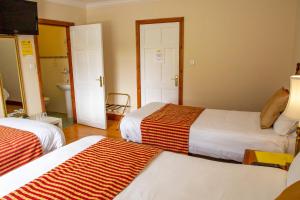 Voodi või voodid majutusasutuse Rockfield Manor B&B, Knock toas